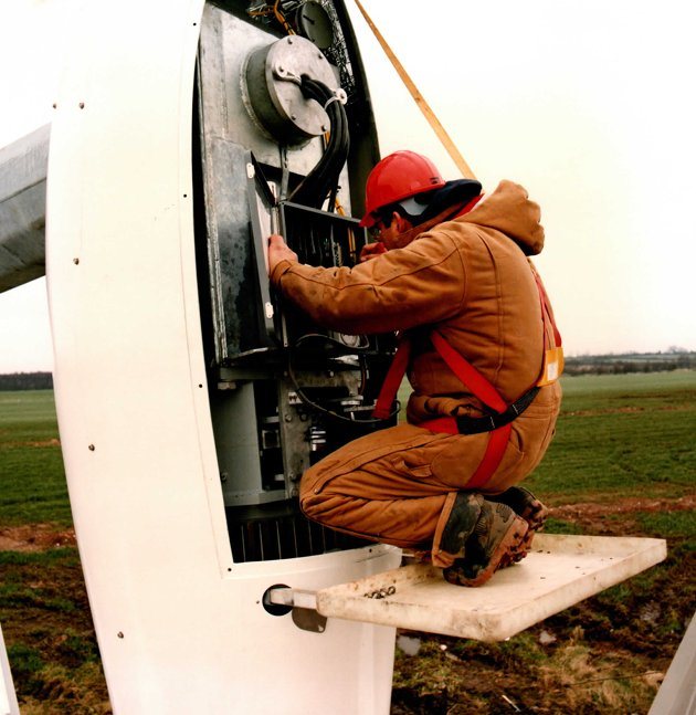 Technician checking the nacelle electrical circuits with the cover open at ground level