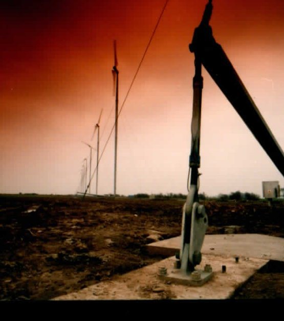 Tower base and hinged pintle bracket on the foundation before the winch is installed