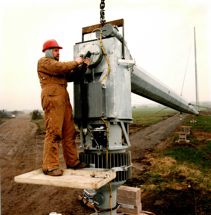 Fitting out the yaw head and generator stack before the tower goes up — all heavy assembly done at ground level.