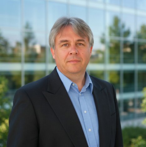 Portrait of Steve, Managing Director of Carter Wind Turbines Ltd, outdoors in a dark jacket