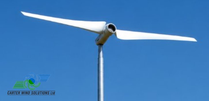 A Carter two-blade turbine head against a clear blue sky, with the Carter Wind Solutions logo in the lower-left corner